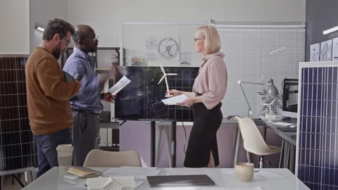 Time Lapse of Multiethnic Engineers Discussing Solar Battery Model at Meeting Stock Footage 313516215