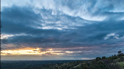 Time Lapse Multiple Layers of Clouds float above Late Afternoon Sun Stock Footage 278976657