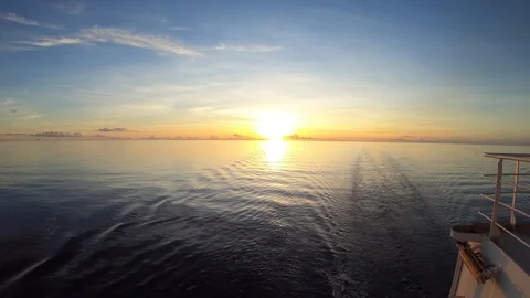 Time lapse of multipurpose vessel sailing away from sunset Stock Footage 115820209