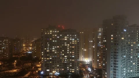 Time lapse of multistorey buildings with changing window lighting at night Stock Footage 102305548