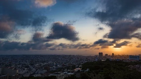 Time lapse of Naha city Okinawa from sunset through to night Stock Footage