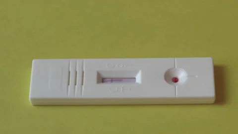 Time lapse of negative COVID-19 test kit for detecting IgM/IgG Ab  Stock Footage 132363680