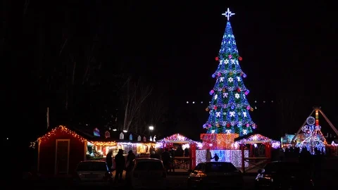 Time lapse neon lights shining bright on festive Christmas market decorations on Stock Footage 100219978