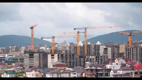 Time lapse New buildings many hoisting cranes and buildings under constructio 스톡 동영상 295386793