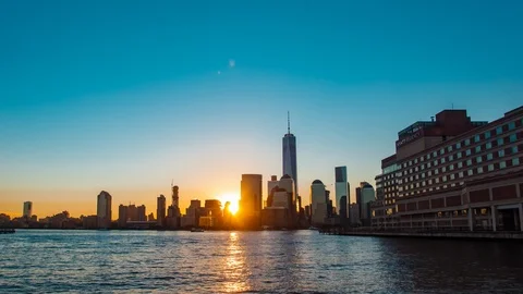 Time lapse of New York City skyline and NYC Freedom Tower at sunrise in morning Stock Footage