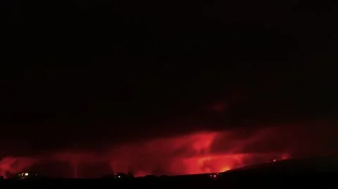 Time lapse night clouds glowing over an active lava flow Stock Footage 12163537