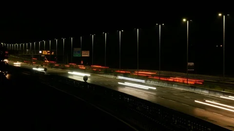 Time lapse at night of an highway with vehicles traffic and road lights Stock Footage 92472437