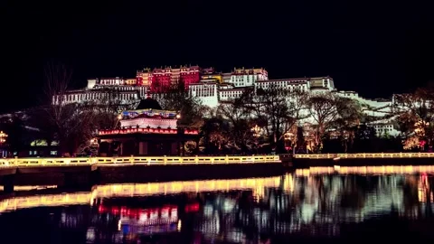 Time Lapse of Night Lake Warm Light Reflection Potala Palace Xizang China Stock Footage 337944909