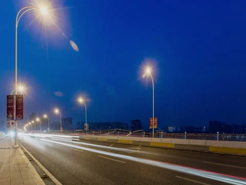 Time lapse night motion light trails on a busy freeway Video stock 74224609