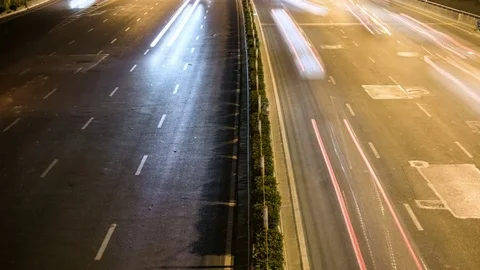 Time lapse night motion light trails on a busy freeway Video stock 74420555