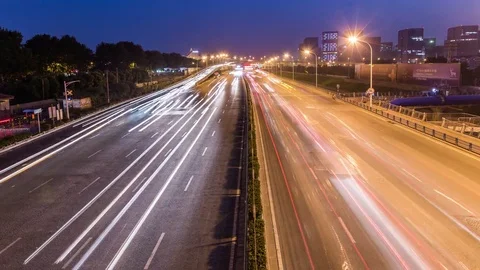 Time lapse night motion light trails on a busy freeway Видео 74422474