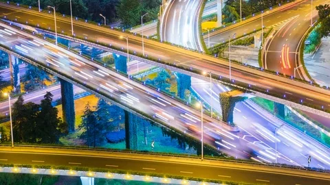Time lapse night motion light trails on a busy freeway Stock Footage 77917774