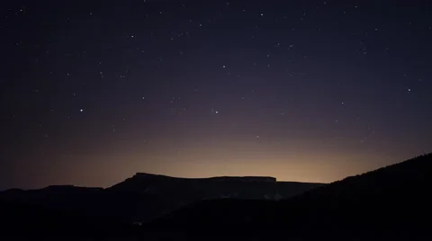 Time Lapse Of Night Sky And Stars With Moonlight Stock Footage 65724379