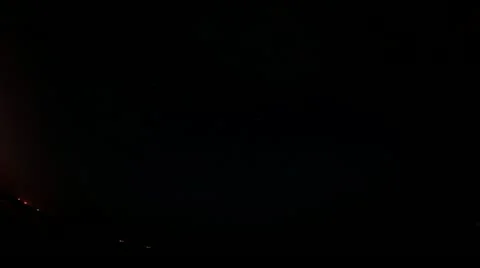 Time lapse of the night sky with clouds and stars passing over the sea Stock Footage 11381264