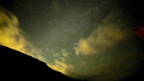 Time lapse of the night sky with clouds and stars Stock Footage 286249739