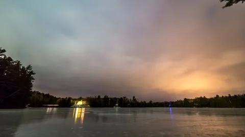 Time lapse of night sky over a frozen lake Stock Footage 68820961