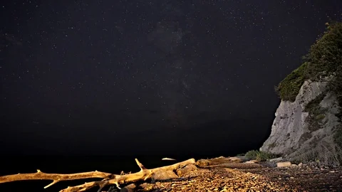 Time-lapse. The night sky over the black. Stock Footage 77465314