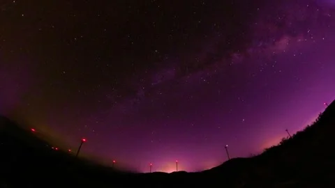 Time Lapse of Night Sky Starry Purple Glow Mountain Shadow Stock Footage 337930564
