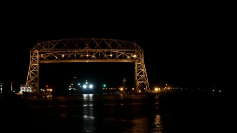 Time lapse at night of two ships going under the Duluth aerial lift bridge Stock Footage 92886108