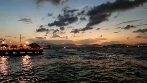 Time lapse of night view of piers and buildings along Victoria Harbour near C Stock Footage 170641835