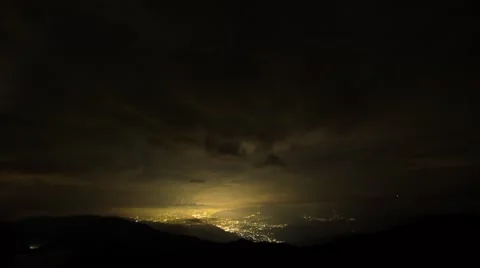 Time-lapse night view of stars over illumihnated city from Mount Daibosatsu, Stock Footage 58466416