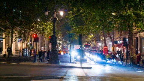 Time lapse night view of traffic and pedestrians passing by Northumberland 스톡 동영상 108043754