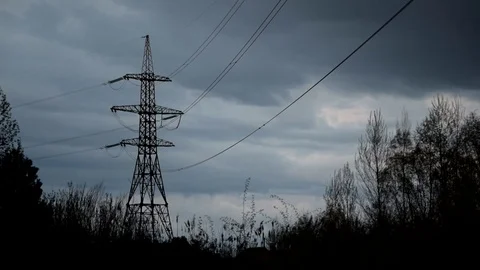 Time lapse of nightfall with clouds and transmission tower Stock Footage 75953076