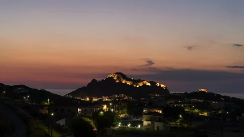 Time lapse of nightfall in Myrina, Greece with scenic lights at Byzantine Castle Stock Footage 115319334