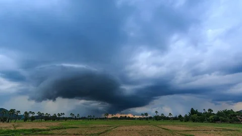 Time Lapse Nimbus Clouds Floating And Raining Over Rural Field Stock Footage 73760222