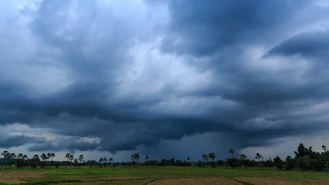 Time Lapse Nimbus Clouds Floating And Raining Over Rural Field (pan shot) Stock Footage 73882358