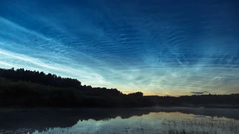 Time lapse noctilucent clouds and fog on water. Noctilucent clouds timelapse. Stock Footage 157990277