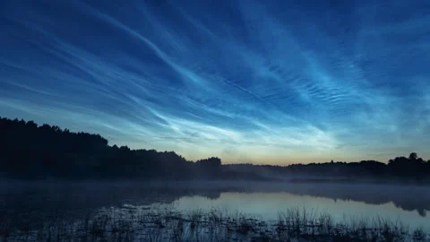 Time lapse of noctilucent clouds over water. Noctilucent clouds time lapse. Stock Footage