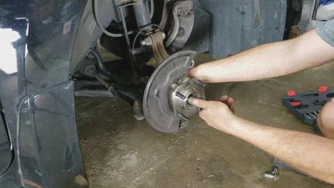 Time lapse of nut being tightened after new bearings were installed in sedan Video stock 129819772