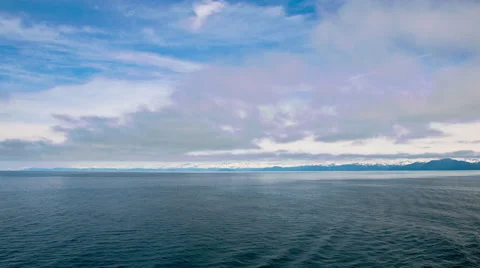 Time lapse of the ocean and blue sky with soft cloud formations, Alaska Stock Footage 52217225