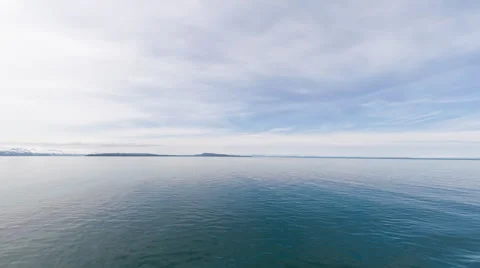 Time lapse of the ocean cloud formations with mountain ridge in the background, Stock Footage 52217292