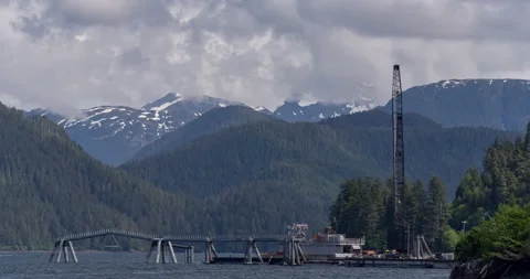 Time lapse of ocean dock with mountain in background Stock Footage 165245391