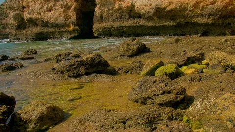 Time lapse of ocean tide, sea cliffs in background Stock Footage 76719221