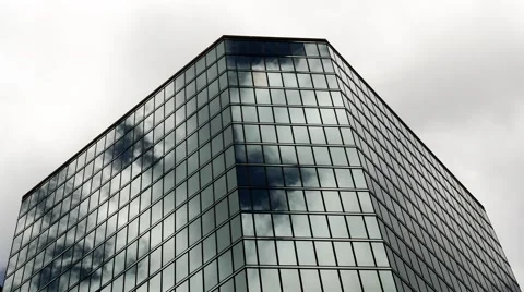Time-lapse of an office building with reflection of fast moving clouds Stock Footage 49277570
