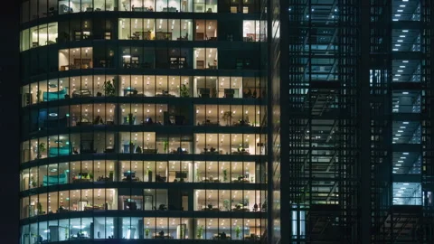 Time lapse office windows lights in business high skyscraper glass surface Video stock 255386442