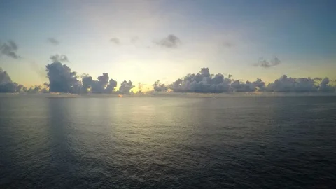 Time lapse offshore sunrise with cloud flow to left side smoothly Stock Footage 108197328