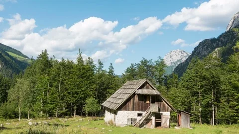 Time lapse of old alpine hut - homestead with meadow and woods in the Alps Stock Footage 78928082