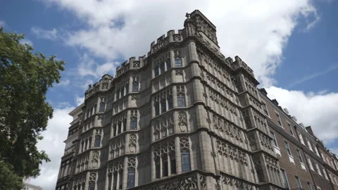 Time lapse. An old gothic style building under white clouds. Stock Footage 114988103