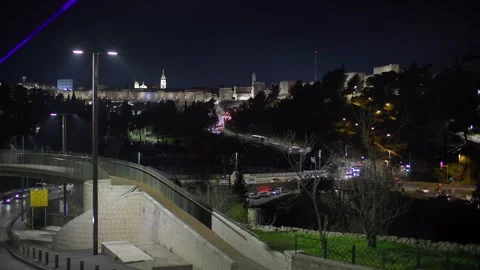 Time-lapse of Old Jerusalem at night with fast-moving traffic Stock Footage 304492755