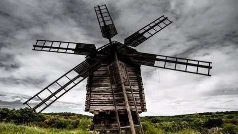 Time lapse old windmill on the background of dramatic clouds Stock Footage 75811616