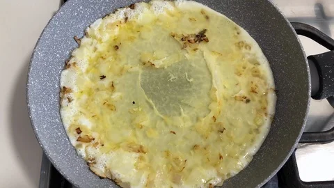 Time lapse of omelette made with onions and only albumen or white egg. Stock Footage 89811488