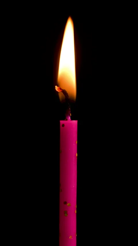 Time lapse of One cake candle burning on a black background. Close up on burning Stock Footage 304806503