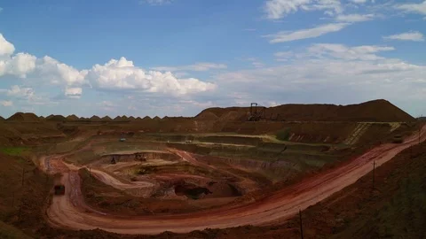 Time lapse of open-cast. Operating mine. Bauxite quarry. Excavators load ore Stock Footage