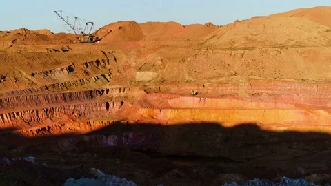 Time lapse of operating mine covering with a shadow at suset. Excavators load Stock Footage 75406423