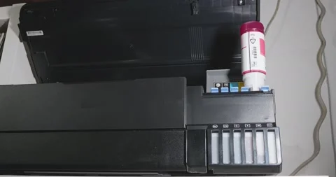 Time lapse for the operator fills the ink containers of an eco tank printer w Stock-Footage 156889140