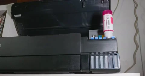 Time lapse for the operator fills the ink containers of an eco tank printer w Stock-Footage 156889149